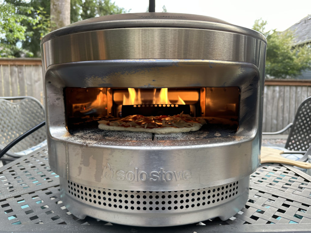 Solo Stove Pizza Oven cooking homemade pizza with gas burner propane attachement