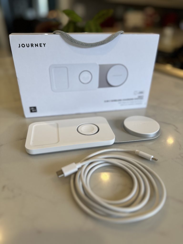 Journey charger SWIV 3-in-1 Foldable Wireless Charger sitting on counter displaying contents of box.