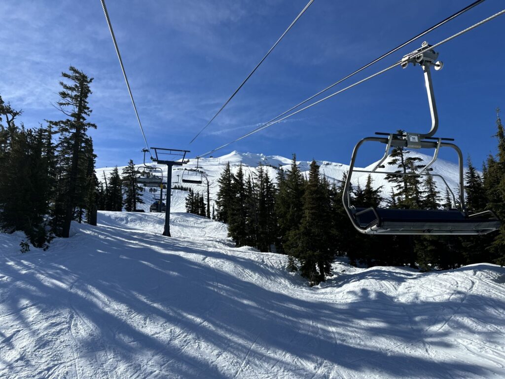 Mt Bachelor Riding Lift Riding a chairlift during a family ski trip at Mt. Bachelor